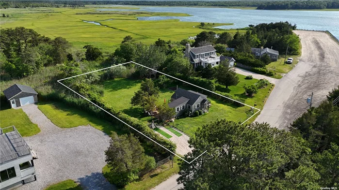 Nowheresville!  Cute fisherman&rsquo;s shack overlooks Northwest Creek, and beyond, to Northwest Harbor, in the rural Northwest Woods of East Hampton, New York. Somewhat over a thousand square feet, this early 20th Century cottage is far from the summer hullabaloo. Drive down the pine-shaded road until you emerge into sunshine, with the blue waters of the estuary and the bay mirroring the sky, and surrounded by parkland as far as the eye can see. Barcelona Neck county park is just beyond the creek; and this property backs to hundreds of acres of forever-wild lands owned by the Town of East Hampton and the County of Suffolk. Across the street, drop a line into the clean salt water; and catch tonight&rsquo;s fresh fish dinner. A handful of boats are anchored a hundred meters from your front door. And just 400 meters away, the bay beach invites you to take a dip in the healing waters of the Atlantic from May to October. The seaside vernacular of this cottage fits perfectly with the natural surroundings. Imagine sipping your morning coffee while enjoying the views from your kitchen House is located across from the cove, where you can apply to have a boat mooring. Situated on a shy half-acre lot, this property offers ample outdoor space for gardening or just escaping from the world. Great opportunity to own this enchanting water view cottage in East Hampton.