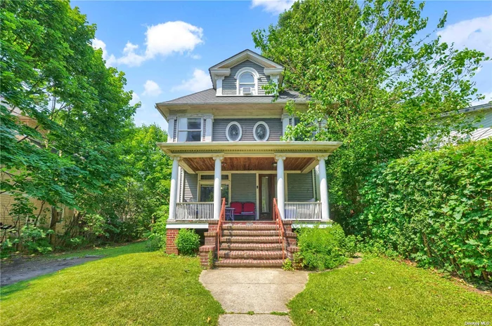 This spacious and charming Victorian, situated on an oversized 60x125 lot with a building size of 24x42, exudes classic elegance. The home features high ceilings and original hardwood floors throughout, complemented by a cozy fireplace that adds to its warm atmosphere. With an abundance of character and exquisite woodwork, the property offers a distinct appeal. The gas heating system is divided into four zones for optimal comfort, and the house is fully insulated. It also includes a 200-amp electrical service. The expansive, park-like backyard provides a serene outdoor retreat. The first floor comprises a welcoming front porch, a comfortable living room, a formal dining room, a cozy family room, a well-appointed kitchen, and a half bathroom. The second floor offers three large bedrooms and two full bathrooms, while the third floor includes two additional bedrooms and one full bathroom. Conveniently located, the home is just a short walk from the E, F, and R subway lines, the LIRR, express buses to Manhattan, Forest Park, shopping destinations, and places of worship.