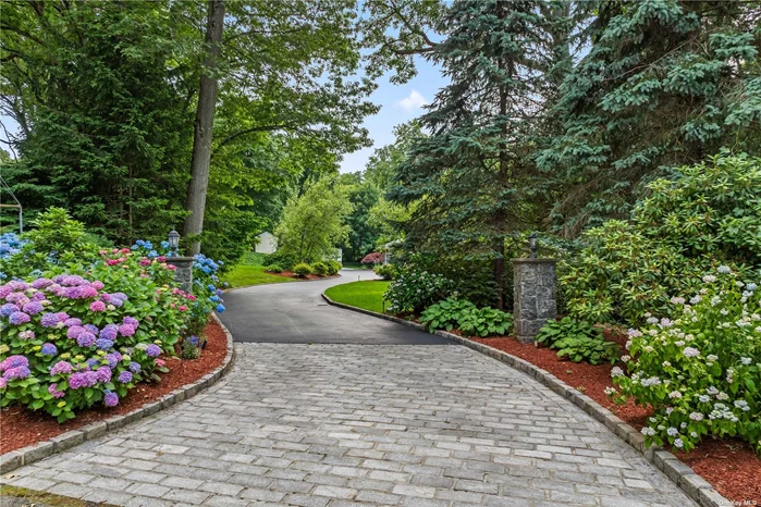 Introducing 66 Woodland Drive! A Spectacular Stone & Shingle Sprawling Ranch Set On Two Serene OBC Acres. The Elegant Entry Welcomes You To This Incredible Residence Flowing Effortlessly To The Formal Living Room & Dining Room. The Gleaming EIK Boasts Radiant Porcelain Tile Floors, White Cabinets With Carrera Marble Counter Tops, Built In Banquette & Gas Cooking. A Chef&rsquo;s Delight! Warm & Inviting The Family Room Offers A Fieldstone Fireplace, Entertainment Cabinet, Wet Bar With Wine Cooler & Miele Coffee Bar. The Lavish Primary Suite Is A Serene Retreat With Spacious Bedroom, White Spa Bath, Porcelain Radiant Tile, Quartz Counter Tops,  Enormous Custom Closets & Access To Lower Level Den. Three Additional Bedrooms Are Large With A Recently Renovated Bath. The Lower Walk Out Level Offers A Second Den/Electric Fpl, Glass Enclosed Home Office, Gym/Sauna, Laundry, Playroom, Mechanicals & Storage. The Rear Property Is Entertainment Ready With Expansive Trex Decking, Outdoor Bar, Outdoor Kitchen And Lower Level Brick Patio And HarTru Tennis. Spectacular Landscaping Surrounds The Residence With Specimen Plantings And Mature Trees. Whole House Generator. Interior & Exterior Sound System. This Is The One You Have Been Waiting For!