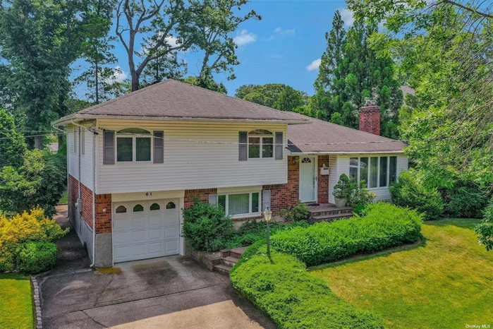 Lovely 3 Bedroom 2.5 Bath on Beautifully Landscaped 1/3 Acre On Tree Lined Street Located In The Heart of Oyster Bay. This Home Offers A Spacious Floor Plan, Hardwood Floors Throughout, Attached Garage, Deck and Patio in Private Backyard. 200 Amp Service, Anderson Windows.