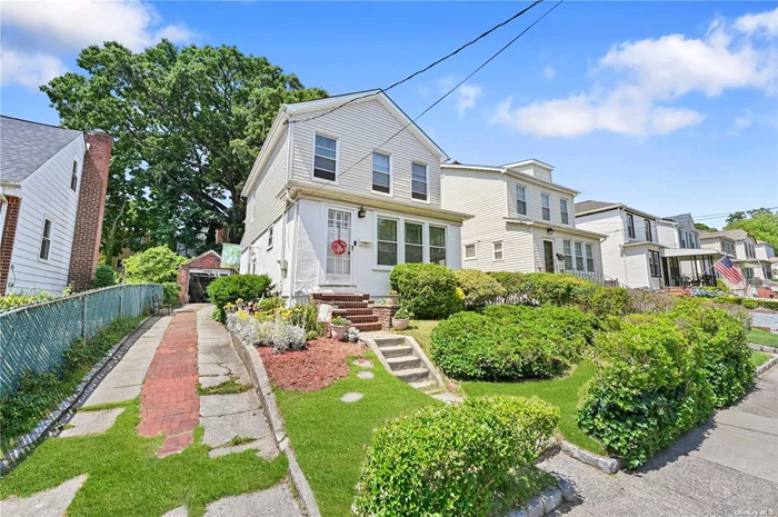 This three bedroom classic stucco colonial is located on a quiet street within a serene neighborhood of Little Neck, Queens. An elegant home built in 1925 with architectural beauty. This property exudes a distinct character, showcasing its stately exterior and interior accented with details. The home features three bedrooms and two baths, as well as a finished basement. The backyard is a private outdoor space with a detached garage and long driveway. Located just 25 minutes from Manhattan, this residence in Little Neck not only offers a tranquil suburban escape but also convenient access to the vibrant cultural and economic hub of the city.