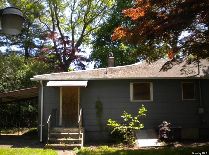 This fixer-upper home holds promise beneath its exterior. With a bit of TLC, its charming architecture could shine through again. The spacious yard, offers potential for a lush garden or serene retreat. Inside, original details like hardwood floors and wood burning fireplace creating a canvas for personalized renovation and modernization. Home is being sold AS-IS.