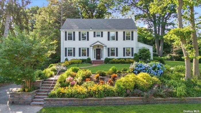 Located on one of Beacon Hill&rsquo;s most sought after streets, this stately 1938 Colonial sits majestically perched on nearly .5 flat, useable acres. The enticing curb appeal is surpassed only by what you will find inside. A grand entrance with elegant primary staircase invites you into this bright and beautifully updated 4 bedroom, 2.5 bathroom home. The heart of the main floor is the newly renovated, state-of-the-art chef&rsquo;s kitchen and great room with butler&rsquo;s pantry and convenient mudroom - the ideal set-up for today&rsquo;s modern lifestyle. The oversized, well appointed living room with wood burning fireplace is perfect for more formal entertaining. And the intimate and comfortable home office/library is perfect for work from home or a quiet reading space or game room. A newly renovated and &rsquo;tres chic&rsquo; powder room rounds out the main floor.? The second floor boasts the primary suite and three additional, very generously sized ?bedrooms and one full bathroom. The partially finished basement is home to ?the laundry room, recreation area, storage and mechanicals.? The meticulously landscaped, very spacious property offers beautiful views of Roslyn Harbor from the front of the home and a flat and endless grassy yard and basketball court in the back.? New roof, full house natural gas generator, wooden shutters throughout, new boiler, new water heater and new AC in addition to central station alarm system, security cameras, sprinkler system, and 2 car garage. Move right in!