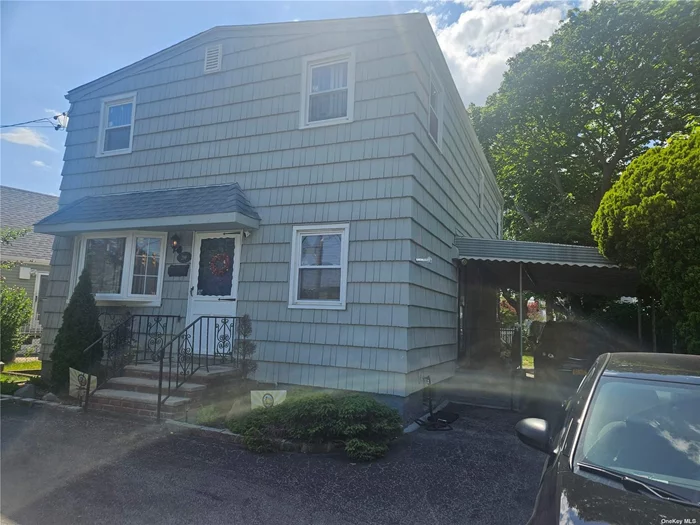 Make this colonial 5 bed 2 bath home with a semi finished basement nestled on a large lot your forever home ! close to lirr , Inwood park, shopping, and house of worship house has solar panels and low taxes !