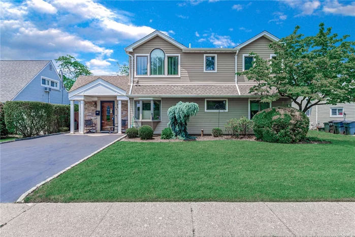 This is the one you have been waiting for. This is an expanded and recently updated model in the Salisbury section of Westbury, featuring: an eat-in-kitchen; huge, bright living room with a working fireplace; a large driveway for plenty of off-street parking; garage converted into great bonus space with a separate entrance; and a private yard with a patio, mature trees/landscaping and a great set up for entertaining. East Meadow schools. Just a short trip to Eisenhower Park and all schools, public transportation and major parkways!