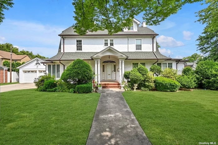 Welcome to This Charming Center Hall Colonial in Prime Bayside. The Main Floor Greets You with a Foyer Leading You into the Spacious Living Room with Fireplace and Family Room with an Abundance of Natural Sunlight Beaming Through the Sliders to the Yard. Seamlessly Entertain in the Spacious Tiled Formal Dining Room and Eat-In Kitchen. The First Floor Also Holds a Full Bathroom. Upstairs You Will Find a Large Landing Area Taking You to Three Bedrooms, a Primary Suite with Walk-In Closet, and a Full Bathroom. The Finished Attic Offers Another Bedroom and Loads of Eave Storage. The Full Finished Basement Adds Great Summer Style Recreational Space with its Family Room Complete with a Half Bathroom, Laundry Room, Boiler Area, and OSE. Closets Galore Throughout Ensuring Plenty of Room for Storage, Eight Split Heating and Cooling Systems, a New Boiler and Hot Water Heater, New Vinyl Windows, as well as Copper Gutters. The Yard Features Pavers and Inground Sprinkles for Easy Maintenance, and a Two Car Detached Garage. Conveniently Located in Close Proximity to Restaurants, Schools, Shops, and Various Modes of Transportation.