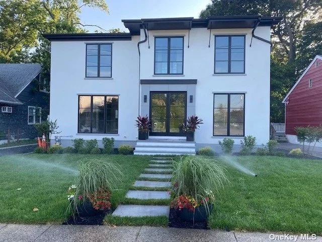 Post Modern gut renovated home. 1st and 2nd Floor all brand new construction with high quality appliances. 1st Floor open floor plan, CAC, wine cooler, den with fireplace. 1st Floor office/5th bedroom. Front and rear sprinklers system.