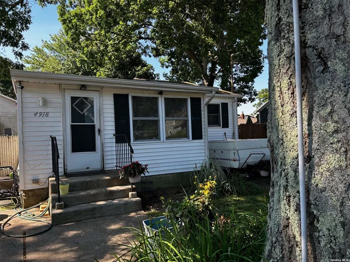 This is a two-bedroom, one-bath home with considerable property. It has low taxes and is close to shopping, transportation, and entertainment.