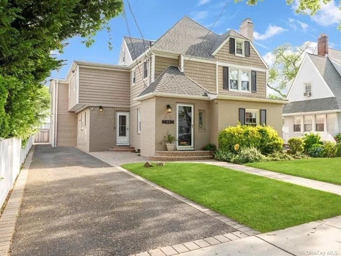 Experience the inviting ambiance of 11 Muirfield, an oversized Colonial that exudes warmth and meticulous care. Featuring a new roof, new siding, a wood-burning fireplace and central A/C! Original preserved details can be seen throughout, from the picture molding and arches to the wood details and doors. The main level boasts a large eat-in kitchen with granite countertops, a peninsula with seating, and updated appliances. The private office/library is a versatile space ideal for working from home or enjoying a personal reading retreat. A formal living room and formal dining room lead to a tremendous den enveloped in windows. Sliders open to the backyard creating unified indoor/outdoor living with a durable Trex deck, pavers and vegetable garden. Upstairs, discover two ensuite bedrooms and two additional spacious bedrooms. The walk-up finished attic is a charming retreat bathed in natural light. The full finished basement and 27 closets provide ample storage space! The property includes the convenience of two separate driveways, a two-car garage, and ample parking for up to nine cars, all within the privacy of a fully fenced yard! Gather, play, tinker, craft - space for everyone and everything in this grand move-in ready home! 1.5 miles to the Long Island Rail Road and the vibrant tapestry of RVC charm, with a plethora of top-notch restaurants, boutique shops, cozy cafes, rejuvenating spas, and recreational activities galore!