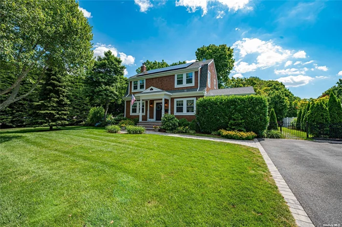 Welcome home to this recently renovated and restored 1909 Dutch Colonial. Located in the heart of beautiful Amityville Village you will have access to all amenities that the Village has to offer including access to both town and village beaches. Freshly restored in 2017 with top-of-the-line materials and appliances throughout, this home features a new roof, owned solar panels, navien on demand hot water system as well as smart thermostats and smart lighting that can all can be controlled remotely from your phone, resulting in extremely low utility costs. The entry foyer leads you into your dining room and formal living room with beautifully finished hardwood floors throughout, as well as granite countertops, stainless steel appliances, and soft-close cabinets in the tastefully appointed kitchen plus a separate half bath on the main floor off of the Kitchen. Upstairs, the hardwood floors continue into your primary suite with ample storage space and a separate primary ensuite bath. There are an additional two bedrooms and another full bath upstairs as well, creating plenty of space for guests. In the fully finished basement you will find a large den/play room area for even more entertainment space as well as a private home office and separate laundry room with all new LED lighting throughout. Step outside into the meticulously maintained backyard featuring ample privacy, a paver patio for entertaining and a beautiful covered porch with access off of the dining room that features well appointed accent lighting creating the perfect space to relax and unwind. You will not want to miss this one!