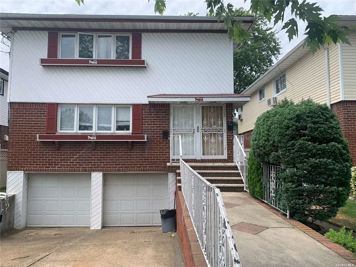 Welcome to This Spacious Two Family Home in Howard Beach. Hardwood Flooring Throughout The First and Second Floors with Generous Size Bedrooms. The Large Livingroom and Dinning Room is Great for Those Family Gatherings as Well as The Eat In Kitchen. The Basement has plenty of room for storage/Work Area.