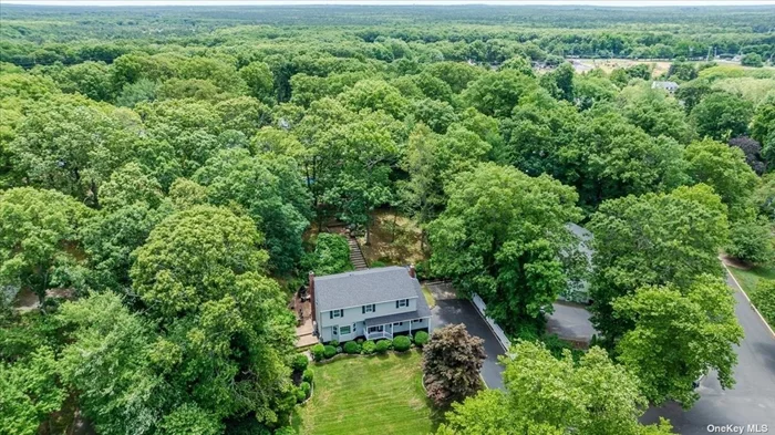 Welcome To This Beautiful Colonial Situated on 0.66 Acre In Wading River. Part Of The The Township Of Brookhaven. (No Peconic Tax). With It&rsquo;s Incredible Curb Appeal, This Home Sits Up On A Slight Hill And Is Surrounded By Nature. Are You Ready To Just Unpack Your Bags And Move In? Then This Is The One You&rsquo;ve Been Waiting For. All Updates Have been Done In The Last Two Years. New Heating, CAC, Floors In Many Rooms, Three New Gorgeous Full Baths, Crown Molding Throughout, Spacious Kitchen With Stainless Appliances, Marble Arabesque Backsplash, Granite Countertops, Luxury Garage Door And More. The First Floor Has All Of The Living Space You Need. Off The Family Room With A Wood Burning Fireplace, Exit To A Covered Deck Which Extends Around One Side Of The Home. Truly An Entertainer&rsquo;s Dream Space. If That&rsquo;s Not Enough, This Area Has Stairs To The Top Tier Of The Yard. Enjoy The Play House With Anderson Windows. (Yes It&rsquo;s Furnished). A Special Feature Is The Pirate Ship. The Second Floor Has Four Bedrooms. The Primary En-Suite Is Large With A Marble New Bath And WIC. In Addition To All This Beauty, There Is So Much Included. Separate List Available But to Name A Few...All The Outdoor Furniture, Outdoor Fireplace, Firepit, Second Fridge And More. Conveniently Located Near Beaches, Parks, Antique Shops, Wineries And More. What&rsquo;s Better Than Feeling Like You Live In The Country With A Vacation Vibe. This Is Truly A Must See.