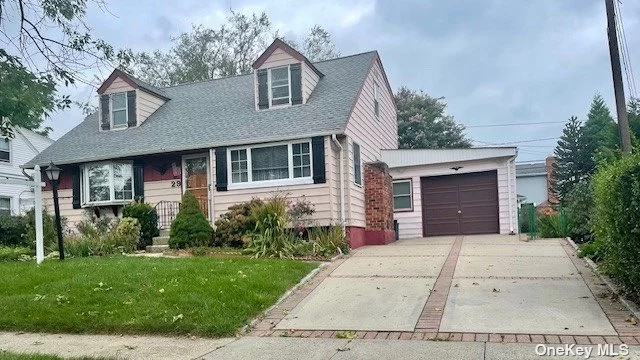 Great opportunity: Pride of ownership is evident throughout this very-well maintained bright and airy half-dormered Cape in the NHP school district. Features large rooms, lots of natural sunlight, ample closet space, 1-car garage, and an extra long and wide driveway for extra parking. Beautiful and oversized private backyard with mature plantings; ideal for entertaining and family events. Convenient to Clinton G. Martin Park Pool, shopping, schools, and restaurants. Easy access to highways. Close to N22 bus on Hillside Ave. to Jamaica, and E Subway to Manhattan.