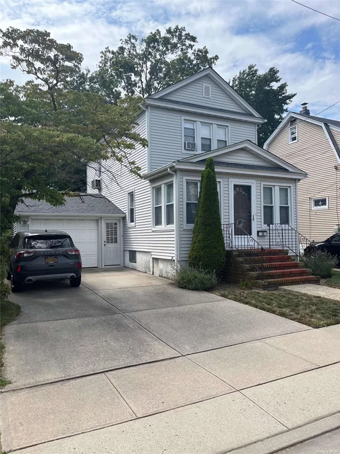 Basement: Half finished. First floor: Enclosed porch, living room, formal dining room, kitchen & powder room. Second floor: Three bedrooms and full bath Attic, oversized private yard, one car garage, new roof and new gas burner.