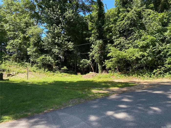 Attention builders and developers! Nestled in a serene and picturesque location, this property has a small cottage on it and also boasts an ADDITIONAL .37 acre parcel beside it totaling just shy of 3/4 acre between the 2 pieces! A possible subdivision could yield some beautiful new construction. Some of the land is cleared, some is wooded. Price includes both pieces! Close to Beaches and all that that Rocky Point and the North Shore has to offer.