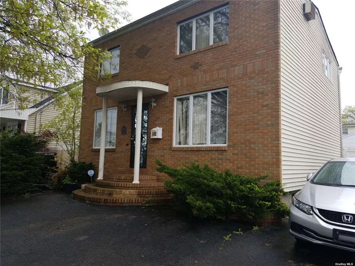 Modern fully renovated large 4 bdrm home in the heart of Elmont with 3 full baths, finished basement, very large kitchen, full bath with skylights on top floor, full bath on 1st floor ... A must see. Owner ready to make a deal this week...