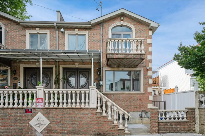 Nestled In Maspeth Plateau on a dead-end block, this stunning brick colonial semi-attached home is one not to miss! Encompassing exquisite natural stone balustrades that guide you up the front stairway to the covered front porch alongside the Juliet balcony. Double door 8ft entryway with vaulted ceiling decorated with chandelier provides a grandiose feel upon entering this home. Gleaming hardwood floors, Anderson windows, and recessed LED lights are just some of the finishes this home has to offer. Boasting 3 bedrooms and 3 full baths, this home features a thoughtfully designed floor plan that effortlessly combines comfort and sophistication. The tall ceilings create an airy, open ambiance, while the radiant heat flooring ensures cozy warmth throughout the seasons. Designed with taste and quality, the Italian inspired Chef&rsquo;s kitchen offers island seating, stainless steel appliances, glass inlay in cabinetry beautifully crafted with rope trim molding, and not to mention the mosaic tile inlay in floor and above the stove&rsquo;s backsplash as a stunning focal point. Massive primary bedroom is complemented with trey ceilings, a huge walk-in closet, and a private balcony. Bathroom on 2nd level, contains a nice sized jacuzzi tub, bidet, and floor to ceiling tile. The home is equipped with an intercom system for easy communication and interior speakers for your music enjoyment. An added bonus to the property is the party driveway to the garage and outdoor space. The lower level is a great multifunctional space for entertaining guests with a laundry room, storage, with 2 separate entrances.  Features: Gas heat w/ Sep Hw Heater, Central Air, 200 Amp Electric, Pure Wash Laundry System, Exterior Surveillance System, Built in 2013