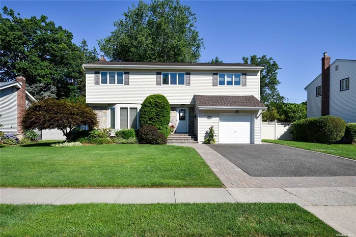 Step inside this magnificent expanded colonial nestled in Oakwood Princeton Park and located in the award winning Jericho School District. Boasting four bedrooms conveniently located on one level, including a primary bedroom adorned with cathedral ceilings, a luxurious jetted tub and separate shower. Accompanying this, find three additional bedrooms and a full family bath. On the main floor, discover a formal dining room, a spacious living room featuring a cozy gas fireplace, an inviting eat-in-kitchen, a family room and a convenient half bath. Step outside through sliders on the main level to enjoy your beautiful yard, complete with a charming patio with a built in gas grill and an inground saltwater heated pool, perfect for relaxation and entertainment. This home offers gas for both cooking and heating, ensuring efficiency and comfort. Descend into the finished basement featuring a tiled floor, a laundry area, a generously sized rec room, and another full bath. Additionally, benefit from the inground sprinklers for effortless lawn maintenance. Recent upgrades include new oak flooring and moulding in family room, a whole house generac generator, new Central air unit with Ecobee thermostat, hot water heater, a new roof with a 50 yr transferable warranty, new Pool liner and salt cell for the Pool, Pella front and storm doors French back door, Anderson windows, Hunter Douglas wooden blinds and Shades, also Custom window trearments, new gutters with leaf guard, new down spouts and soffits, as well as a garage tek organizations system. Welcome to your new home!!