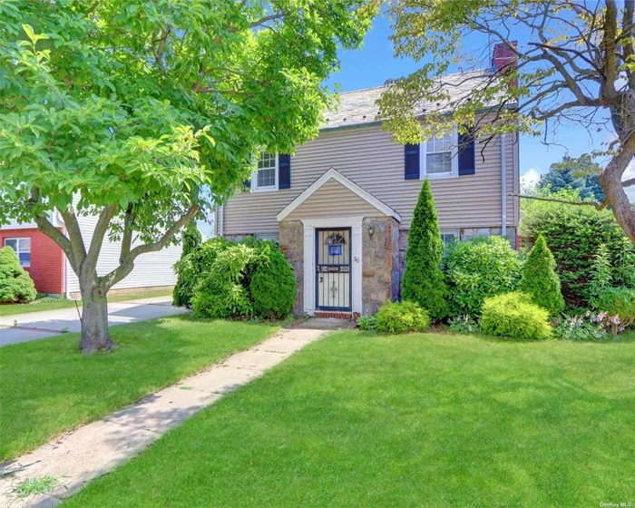 Beautiful traditional colonial style home with original slate roof, fieldstone, frame construction marvelously accented with exceptional stone facade, offering a full basement, attached garage, mid-block location and lovely yard. Great location providing ease of access to many area conveniences.