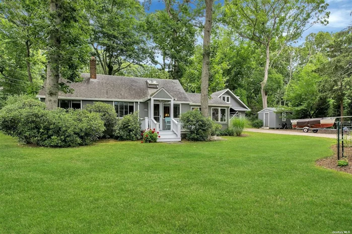 Quintessential North Fork Summer Cottage - This precious 1930s Goose Bay Estates 3 bedroom, 1 bath seasonal cottage harkens back to those lazy days of summer when swimming, fishing, clamming, sailing, outdoor showers, and rainy-day board games were de rigueur. Lovingly renovated between 2014 -2018, this charming property has lovely water views and sunsets, 2 association beaches, a kayak/paddle board launch ROW directly across the lane, a quick paddle to Goose Creek Beach, and a bike ride to Cedar Beach and town. There is also a wonderful detached garage/boat house/laundry with a bonus loft above. The perfect Retreat for those looking to Relax and Recharge!