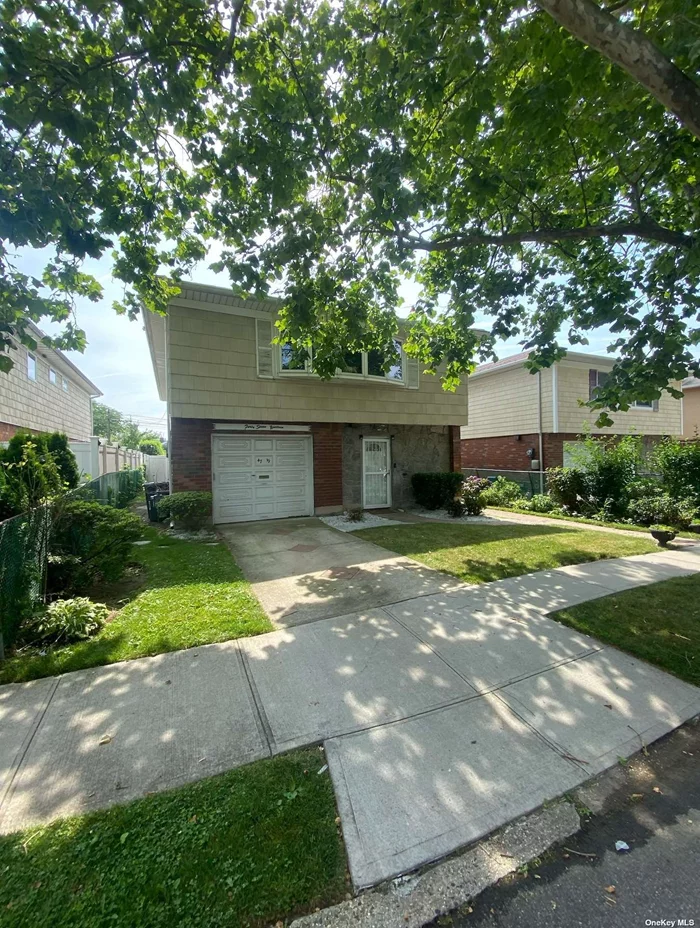 This charming detached single-family home is located in the prime area of Flushing with mother-daughter house layout. This well-maintained residence features 4 bedrooms and 3 full bathrooms, providing ample space for comfortable living. Building dimensions 27x50, total 2500 sqft. The bright and airy interior boasts a spacious living room, a dining area, and a modern kitchen. Enjoy the convenience of a private driveway and a garage. The property is situated in a prime location, within walking distance to Kissena park, restaurants, and public transportation.