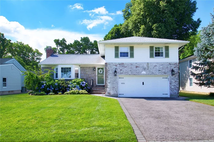 Welcome to this sunny, inviting split-level home located in the Northeastern Section of Garden City. Situated on a quiet street, this midblock residence boasts all the features needed for immediate move-in. The main level features gleaming hardwood floors and new carpet runners on the stairs. A spacious open-concept kitchen with a coffee bar, wall oven, whole home water filter system and stainless steel appliances flows seamlessly into the dining area and living area, adorned with large, sunny windows. Upstairs, you&rsquo;ll find three bedrooms including a primary suite with an en-suite bathroom and walk in closet, an additional hall bath, and wide staircases. The lower level offers a cozy den with a mudroom, half bath, slider door access to the rear yard, and a two-car integral garage. The basement serves as a versatile play space with utilities, new boiler, and laundry. Outside, enjoy a beautifully manicured yard featuring a paver stone patio, mature hedges with fenced in yard, and updated in ground sprinklers, and ample play space. Conveniently located near schools, parks, highways, shopping, the village, LIRR, and more. LOW TAXES