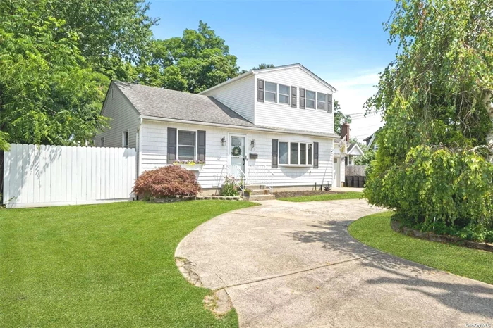 Welcome to 121 Commack Rd in Islip! This meticulous two-story home is a commuter&rsquo;s dream ideally located between Sunrise Highway and the Long Island Railroad. Upon entry, you are welcomed by a sun-drenched formal dining room, perfect for holiday gatherings. The dining room flows seamlessly into the expansive eat-in kitchen which is a cooking enthusiast and entertainer delight featuring an open concept with a large center island, stainless steel appliances, a 6-burner cooktop with griddle, and a double wall oven. The kitchen dining area and double Anderson sliding glass doors add to the charm. Enjoy the spacious living room just off the kitchen boasting a vaulted ceiling, a gas fireplace, and a second set of sliding doors leading to the backyard. The main level also includes a half bath and a lower-level primary bedroom with two walk-in closets. Wood floors extend throughout the main level and the 1.5-car garage is conveniently located right off the kitchen and houses the gas heating system and hot water heater. Upstairs you will find two sizeable, freshly painted bedrooms, with new wall-to-wall carpet and a full bathroom. The lowest level consists of a full basement with high ceiling and houses the laundry area, a storage room, and ample additional storage space. This incredible home also features a circular driveway, a large deck off the back of the house perfect for outdoor dining and relaxing on warm summer nights, and a well-maintained fenced-in backyard with room for a pool. Top the charm of this home and it&rsquo;s location with the fact that you also have access to Islip Town Beach just down the road. This home is a must-see!