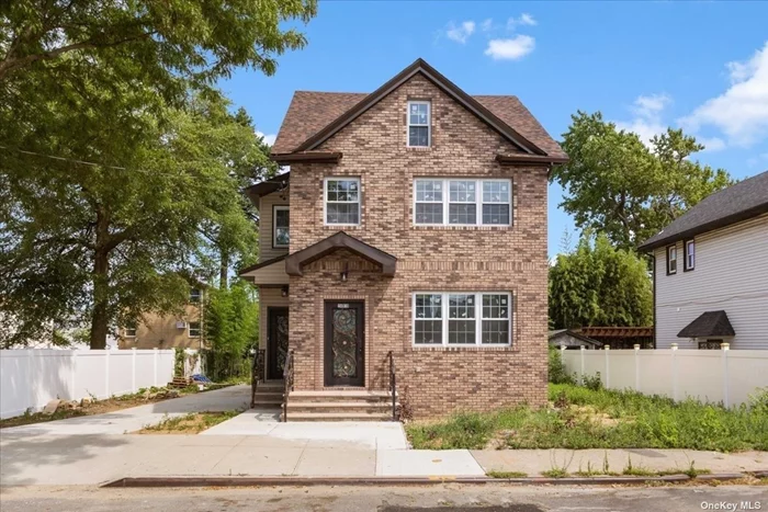 Discover this stunning two-family home in Springfield Gardens, boasting 6 bedrooms and 5 bathrooms. This modern residence features elegant finishes, including gleaming hardwood floors and top-of-the-line stainless steel appliances. The fully finished walk-out basement offers two separate entrances, providing flexibility and convenience. Situated on a sprawling lot, this property provides ample space for outdoor activities and potential future enhancements. Ideal for large families or investment purposes, this home combines luxury and functionality in one perfect package.