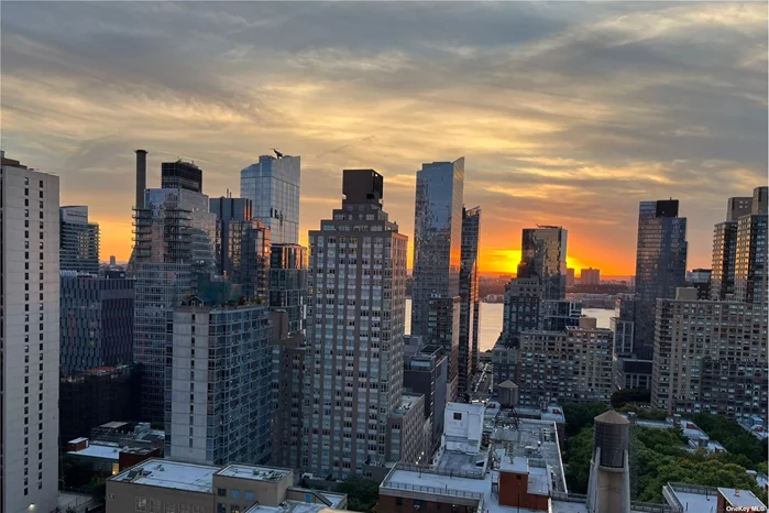 Welcome home to the Alfred at 161 West 61st Street. Apt 23C is a sanctuary of tranquility perched above Lincoln Center, the stuff of dreams for the bonafide Upper West Side arts lover. Twenty-three floors above it all, floor-to-ceiling windows and a wrap-around balcony offering views of Lincoln Center, Central Park, and the Hudson River crown this quiet two-bedroom, two-bathroom gem. Upon entering, you&rsquo;ll find a spacious entryway separating the sleeping and living spaces of the home. To the right of the entry are the washer-dryer, a full bathroom, a bedroom that can be used as an office and guest room, and finally the primary bedroom with en suite bath. On the left of the entry, you&rsquo;re greeted by spectacular city views, river views, a large living room, and a dining area, with a discreet kitchen separated from the rest of the space by a custom-designed and built Shoji screen. Every room in this elegant home enjoys sweeping views of Lincoln Center and the lack of sky-rise obstructions provides ample light into the apartment throughout the day. Residents of the Alfred have access to its Olympic-sized swimming pool, gym, and private, gated garden. Ballet and opera lovers will also appreciate The Alfred&rsquo;s exclusive, gated, back entrance that lets out directly onto Lincoln Center and is accessed by an electronic key fob only available to residents. At the Alfred, you are only a few blocks from Central Park, Riverside Park, Columbus Circle, and several subway lines. Come and see all that 23C has to offer. This is the pinnacle of Upper West Side living.  Please note: New York City, school choices, especially for middle and high schools, often involve a process called screened programs. These programs evaluate applicants based on various criteria such as academic performance, attendance, standardized test scores, and sometimes even additional assessments like interviews or auditions. The aim is to match students with schools that best fit their academic and extracurricular interests and abilities. **Additional Assesment per month: $744.93 - December 2026**