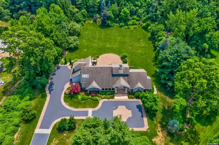 A long private secluded landscaped driveway leads you to this stunning contempory Expanded farm Ranch located in SYOSSET SD in Oyster Bay Cove on a private quiet cul de sac . This custom contemporary style Expanded Ranch will immerse you in light from the wall of windows in the great room and every room throughout showcasing the 2 stunning landscaped acres. 6 bedrooms 6 1/2 baths. Primary Bedroom suite on main level with large bath and Walk in Closets . Massive lowel level with a separate outside entrance has multible finished rooms and 2 full baths for all your entertaining needs. home gym with sauna. 3 car garage with private driveway that can accomodate mutible cars. 6 zone heating 4 cac zones 13 zone underground sprinkler system .Private Beach rights! Moor you boat from your private beach. kayak. swim. Close to LIRR, shops, Restaurants, and all town beaches!