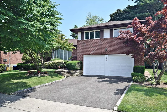 Welcome to Bright and Cozy Split Home in the heart of Woodbury Hills! This Perfectly situated midblock home features vaulted ceilings in the living room and formal dining room, complete with built-in cabinetry. The Master bedroom include a full bath and the family room offers an outside entrance. Enjoy the charm of hardwood floors and the convenience of an upgraded eat-in kitchen with Andersen windows throughout. Additional highlights include a new hot water heater, a new oil tank, a concrete patio, a lawn sprinkler system, and a 2-car garage. The beautifully landscaped and manicured yard completes this inviting home.