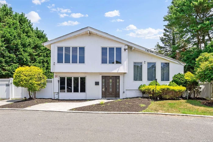 Completely renovated split-level home situated on a spacious lot with a huge driveway that can easily accommodate 4+ cars. This stunning property features 4 bedrooms and 3 full bathrooms, including a finished basement. The kitchen boasts granite countertops, and the home is equipped with central AC for year-round comfort. Conveniently located close to shops, schools, parks, and the LIRR, this home offers the perfect blend of modern amenities and prime location.