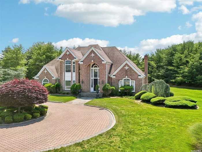 This stunning all brick expansive colonial is nestled in a sought after location within the private Village of Head of the Harbor. Comprising of 5 Bedrooms and 3 full Bathrooms, this home exudes timeless elegance with its classic brick exterior and stately presence. Set on a lush 2-acre lot, this property is surrounded by other beautiful homes, creating an ambience of sophistication. Upon entering, you&rsquo;ll be greeted by a dramatic two-story formal entry featuring a custom staircase that sets the tone for the elegant interior. This home is great for both entertaining and everyday living. The eat-in kitchen features cherry cabinetry, granite counters, and a cozy dinette area that seamlessly flows into the inviting family room with a fireplace. Throughout the home, you&rsquo;ll find wonderful details such as 9-foot ceilings, custom moldings, and beautiful wood floors. The spacious dining room is a standout feature, adorned with tray ceilings and large windows that flood the space with natural light. Floor-to-ceiling windows throughout the residence create an open and airy atmosphere, allowing you to fully appreciate the surrounding beauty. The formal living room is spacious and features French doors and large windows. The primary bedroom suite is a true retreat, providing a serene space to unwind and relax. Each additional bedroom is generously sized, ensuring comfort and privacy for all. The full basement and 3 car garage provide ample room for storage. This home&rsquo;s desirable level 2 acre setting provides the perfect balance of tranquility and accessibility. Located just minutes from Town, the LIRR, and LI Sound beaches and marina; this home is great for those seeking a luxurious yet comfortable lifestyle. Don&rsquo;t miss the opportunity to make this exceptional home your own.