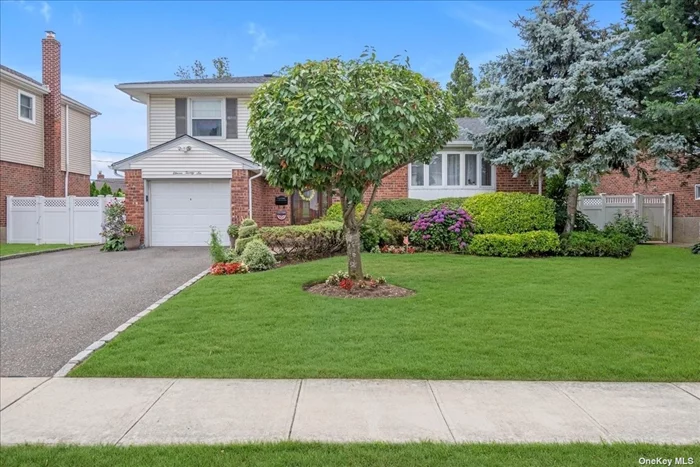 Discover this beautiful 3 bedroom, 2 full bath split-level home located in the coveted Salisbury Estates neighborhood of Westbury. This home features a large living room with bay windows that provide abundant natural light, creating a bright and welcoming atmosphere. The open dining room offers seamless access to the backyard deck through sliding doors perfect for indoor-outdoor entertaining. The kitchen is highlighted by vaulted ceilings, granite countertops, an island, and Bosch & Thermador appliances making it a chef&rsquo;s dream. There is a large office space with a door leading to the yard, ideal for working from home or to use as a flex space for your needs. The beautiful yard is perfectly designed for entertaining featuring a deck and patio for gatherings or relaxation. Other features to mention are the hardwood floors throughout, central ac/heat, central vacuum, wash area in the basement, 1-car garage with driveway, etc. Within close proximity to the LIRR, ensuring an easy commute to Manhattan and other areas, shopping areas like the Roosevelt Field Mall, The Gallery at Westbury Plaza and much more, parks, eateries, and schools. This exceptional home in Salisbury Estates offers a blend of elegance, functionality, and a prime location. Call to set up a private viewing before it&rsquo;s gone.