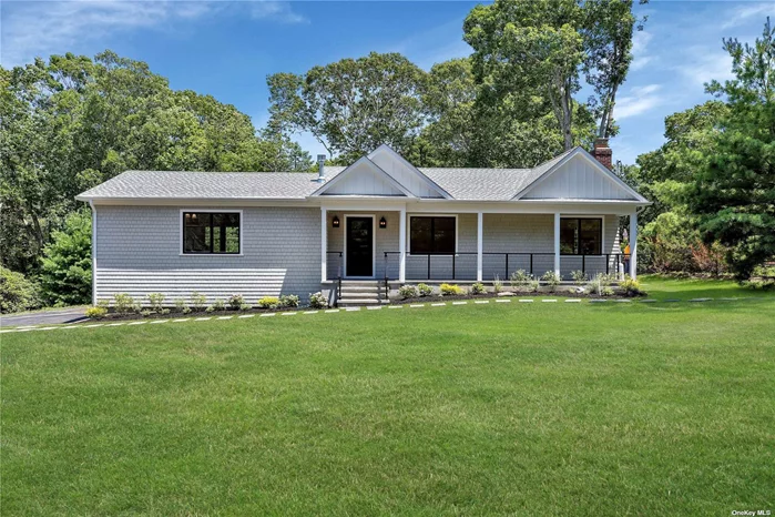 No stone has been left unturned with this beautiful fully renovated sprawling ranch located in the sought-after Fleetsneck section of Cutchogue with private beach association. Ideal for modern-day living, soaring ceilings, custom built-ins and a marble gas fireplace accent the kitchen, dining and living areas which flow seamlessly into one another. An airy primary ensuite with a second gas fireplace, two additional bedrooms and two full baths complete the first floor while a fourth bedroom and a fourth full bath are located on the finished lower level. Perfect for entertaining, a 700 sq. ft. Trex deck, brand new heated inground pool, outdoor shower, and professionally landscaped yard, complete this special North Fork home. Come and make it your own!