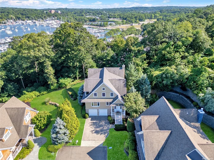 Magnificent, custom built, colonial style home with outstanding attention to detail, meticulously cared for and replete with quality finishes. This masterful home is located at the top of a beautiful cul-de-sac, perfectly positioned for exceptional yard enjoyment and the tranquility of and multiple water views. Ease of access to local beaches. Possessing exquisite, well-planned living space in excess of 4000 SF, this recently enhanced colonial will take your breath away.