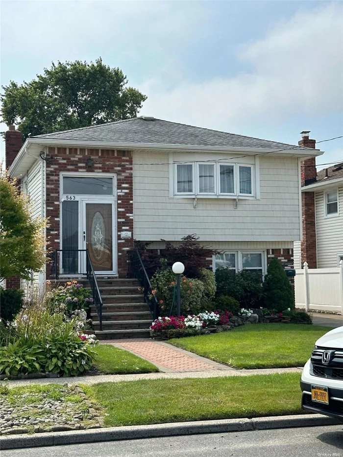 Gorgeous mint condition first floor sun filled 2 bedroom. Kitchen w/ shaker cabinets & granite counters & Stainless Steel appliances , tile floor throughout , Bathroom with walk-in shower & vanity w/ granite counter. Walk out to ground floor patio