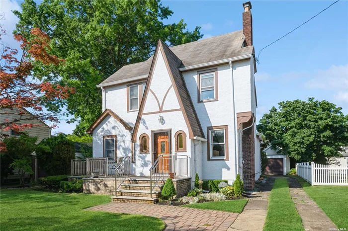 4 Level Tudor with over 2, 000Sf of living Space. Main Floor Family Rm w/Sliders to Deck and Oversized Yard. Sunny Eik w/Cathedral Ceiling and plenty of White Cabinets. 2 Primary Bedrooms on the 2nd and 3rd Floors (w/ Master Bth). 3 Split Units, Hw Floors, Front Porch, Gas Cooking. Come See the Charm and Character of this Unique Tudor.