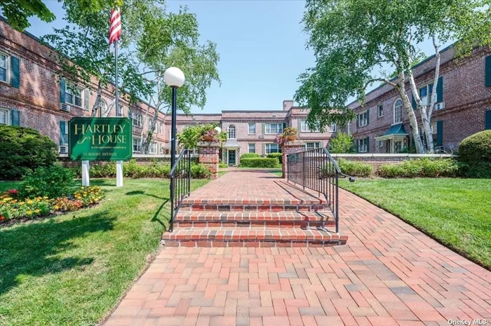 This well-maintained corner1-bedroom second (top) floor unit features a white EIK with pantry, spacious living rm/dining rm area w/walk-in-closet & new AC unit, beautiful crown molding, entry foyer with closet, sizable primary bedroom, full bathroom, hardwood floors, tall ceilings & in-wall ACs. Hartley House features a storage room, bike room, laundry room and is conveniently located within close proximity to the LIRR, houses of worship, library, village restaurants and shopping. Short waitlist for lot parking and near residential municipal parking lots. A Must See!