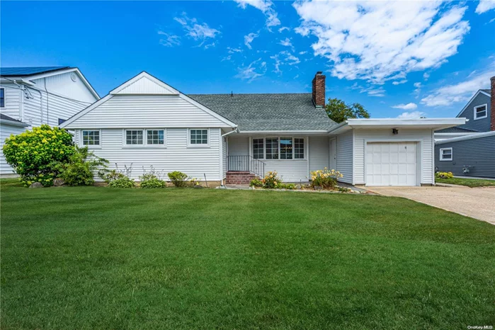 Welcome to this completely updated 4-bedroom, 3-bathroom extended cape in the Village of East Rockaway, within the prestigious Lynbrook school district. This beautifully renovated home offers a blend of modern amenities and classic charm. The inviting entry foyer sets the tone, leading to a cozy living room with a wood-burning fireplace, perfect for relaxing evenings. The dining room is ideal for family meals and entertaining guests, while the den provides additional living space for a home office, library, or playroom. The updated eat-in kitchen features contemporary finishes, perfect for the home chef. The first floor boasts a spacious primary ensuite bedroom with a private bathroom, an additional bedroom and bath, and a conveniently located washer and dryer area. The second floor offers two spacious bedrooms, an updated bathroom with modern fixtures, and storage space. Additional features include a utility room, a lovely backyard with a patio area for outdoor living, and a new gas Navien heat/hot water system. The home also has 2-zone heat and 2-zone central air conditioning, a new roof, windows, and vinyl siding, ensuring it is well-maintained and energy-efficient. The full house water filtration system ensures clean and safe water for your family. Located close to beaches, restaurants, shops, houses of worship, and public transportation, this move-in ready home offers modern updates, ample living space, and a prime location. Don&rsquo;t miss the opportunity to make this wonderful house your new home!