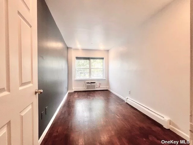 Condominium a two- bedroom apartment, newly renovated in a convenient location in Corona, features hardwood floors, new AC units, a new refrigerator, large walk-in closets, access to a large backyard. Rent includes cold water only. Close to public transportations, school and park.