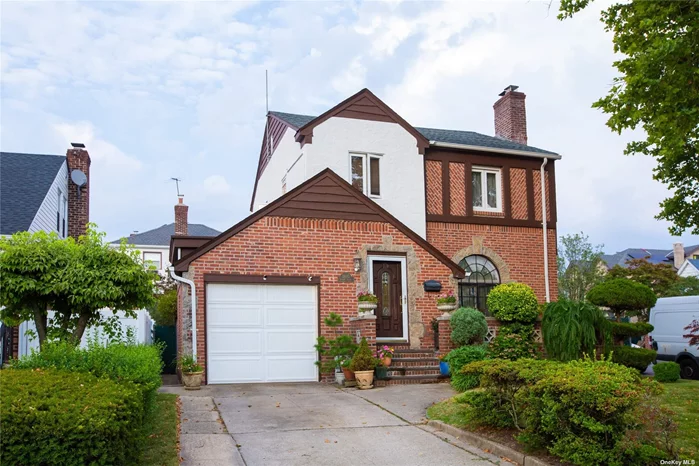 Excellent Det Tudor 1 Dwelling, Big Living Room with Fireplace, Wood floor, 3 Bedrooms, 3 Bathrooms.  5 split Unit A/C. High Ceiling pull down Attic, Fully Finished Basement with granite floors. Side Door Entrance. Convenance To All Bus Q16, Q28, Q76 & QM 20.