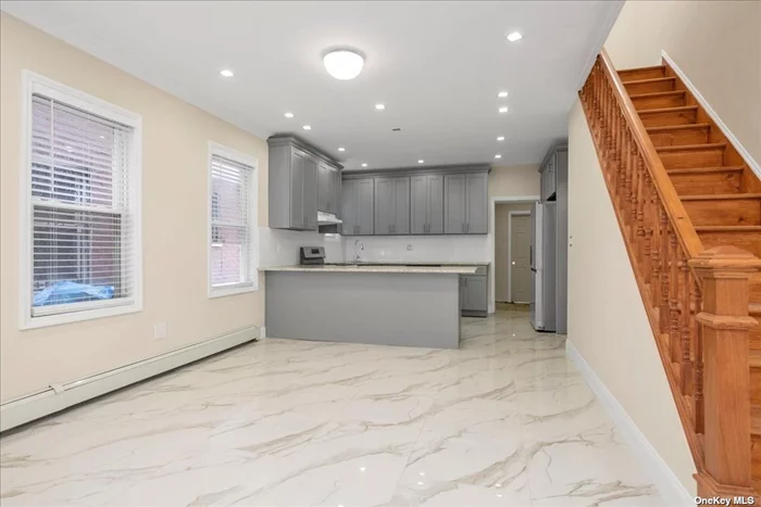 Newly Renovated 4 Bedrooms, 3 Full Bathrooms, Living+Dining+Kitchen Combo, Full Finished Basement with separate entrance, Shared Driveway+Backyard, blocks away Sutphin Blvd.Bus to E/F Train