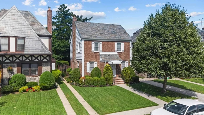 Discover this exquisite and impeccably maintained detached brick Colonial. This stunning residence boasts 3 generously sized bedrooms, 1.5 luxurious baths, and a 1-car garage. The home also features a spacious attic and a partially finished basement. The slate roof and brick exterior add a classic charm to this beautiful property. The landscaped backyard is ideal for relaxing and entertaining. Located in the heart of Bayside Hills, this home is by parks, shopping, and dining. Perfectly situated near the LIRR, Northern Blvd, and Bell Blvd, it provides unparalleled convenience to transportation. Seize the opportunity to own this elegant Bayside Hills home!