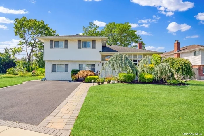 Welcome to this move-in ready split-level home located in the heart of White Birch, Jericho. This well-lit residence boasts a carefully designed interior featuring three generous bedrooms and two full baths. The living room is welcoming, with natural light streaming through the skylight. The open quartz eat-in kitchen, with its high ceilings, is a cook&rsquo;s dream, complemented by a dining room with sliders to a deck.On the first floor, you&rsquo;ll find an oversized den with direct access to the backyard and an additional full bath. The fully finished basement provides extra storage and utility space, while a two-car driveway ensures convenient parking. Situated in a private location, this home offers easy access to schools, shopping, dining, and all major roadways. Located in the Jackson Elementary - Jericho School District. Don&rsquo;t miss out on this fantastic opportunity!