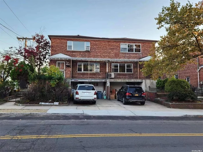 Prime location in CP; close to buses, park, shop and library; Legal brick two family w/three level on the ground; corner house w/ private driveway & garage; side & backyard; Ideal for owner occupying and investment.