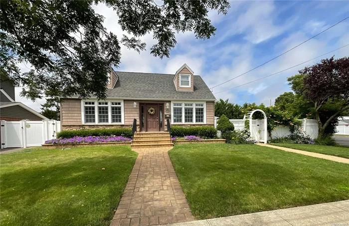 Welcome to this Charming Massapequa Cape (4 bedrooms converted to 3) on an oversized corner property. First floor has open concept living area with lots of windows and natural light leading into kitchen. Kitchen walks out to beautiful resort like yard with built in custom heated in ground pool that is 35&rsquo; long and has built in lounge steps. Yard has excessive gardens and multi-level stone decks and patios. Yard is fully fenced with 6&rsquo; PVC fencing and multiple arbors. Perfect home for gatherings, parties and BBQs. Also has 2 car detached garage with a full upstairs and dormer. Plenty of room for storage. Quick stroll to elementary school, junior high, LIRR and Massapequa nature preserve and bike paths. House has updated electric and backup generator. Unfinished basement with gym and laundry area. Newly carpeted upstairs bedrooms.