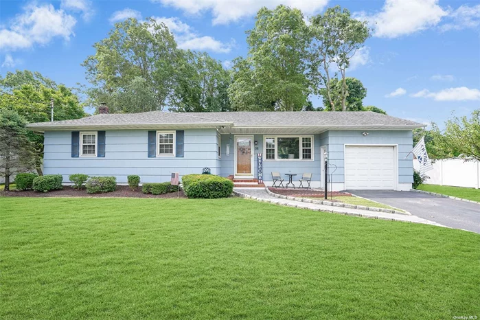 Welcome home to this charming and smartly updated 3-bedroom ranch, situated on nearly 1/3 of an acre of level land. Upon entering the living room, you will immediately notice that you have stepped into a loved and well-cared-for home. It feels comfortable with central AC and relaxing with its cleanliness and calming color palette. The hardwood floors extend into the dining area and kitchen, as well as down the hall to the three nicely painted bedrooms, which feature crown molding and large closets. The beautifully tiled full bathroom includes a tub, making relaxing or playful baths a possibility! In the spacious kitchen, you will appreciate the granite countertops, tile backsplash, and thoughtful layout. As you prepare meals, your guests can enjoy the airy feel of this space, which offers two different access points to the outdoor living area. Stepping onto the brand-new patio and surveying the backyard, you will notice it is fully fenced with gleaming white PVC. Beyond the fence, all you see are the green deciduous trees that fill the undeveloped land, giving you a park-like feel and privacy. There are a few beautiful shade trees on the property, set back from the house, and the well-maintained lawns are irrigated by an automated in-ground sprinkler system. There are ample sunny areas and open spaces for a garden or future pool. This property truly has it all. You can park 2 cars in your driveway and another in the very deep garage, which also has stairs leading down to the full basement. While mostly unfinished, the basement features built-in shelving, has been painted, and is well-lit, making the laundry area feel like a part of a living space. This basement has tons of potential, and the garage can be used as an outside entrance. Put this one on your schedule now and be among the first to see this versatile home!