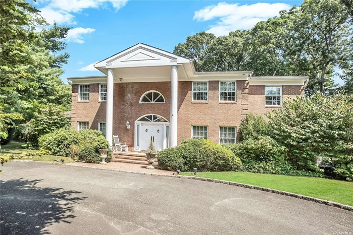 NESTLED IN A PRIVATE CUL-DE-SAC IN THE PRESTIGIOUS VERSAILLES ESTATES OF MUTTONTOWN! This 7-bedroom colonial boasts over 5 bathrooms, a grand entrance that will leave your guests in awe, and a stunning spiral staircase that adds a touch of elegance to the space. This estate offers an indoor pool for relaxation, a game room for entertainment, a bar area for social gatherings, guest quarters for visitors, a spacious 3-car garage, a massive basement for all your needs, and 2.17 acres of serene private property for ultimate tranquility. Live in luxury and style in this truly exceptional residence. Gas Cooking, Central Air Conditioning, In ground Sprinklers and So Much More. FUN FACT - This Home Was Featured in the Movie Meet the Parents. A MUST SEE!!