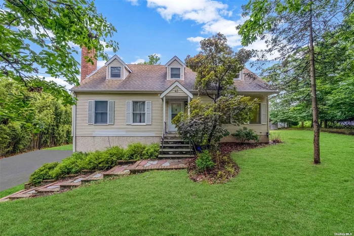 Discover the potential of this 4-bedroom, 2-bathroom Cape Cod at 43 Misty Rd. Set on a third-acre corner lot, this home features over 1, 700 square feet of living space with hardwood floors, a large master bedroom, and a wood-burning fireplace. Enjoy a partially finished basement and a deck accessed by a slider door. Conveniently located in a quiet neighborhood, just a short walk to Friendship Beach and close to North Shore amenities. Note: Some TLC needed for the older Anderson windows. Ideal for those ready to customize their dream home in the Rocky Point School District.